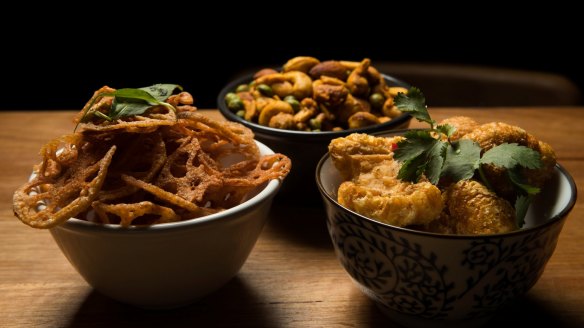 Lotus root chips, five-spiced pork scratchings and The Colonel's spiced nuts at Luxsmith.