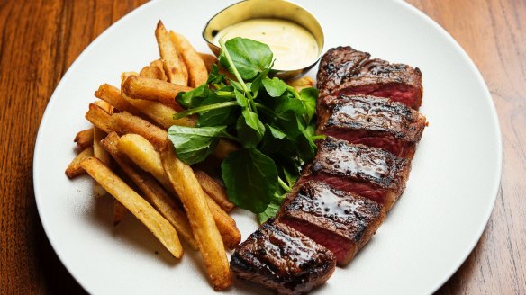Steak frites with triple-cooked chips, watercress, and bearnaise.