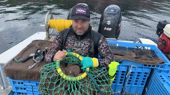 NSW abalone diver Ryan Morris with a haul of the prized shellfish.