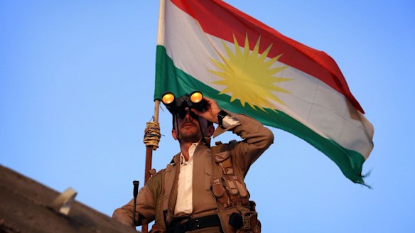 A Kurdish Peshmerga fighter holds a position on the front line in the Gwer district, 40 kilometres south of Erbil.
