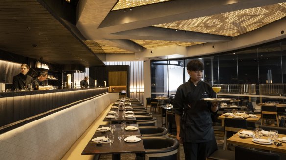 Japanese restaurant Kazan's ceiling riffs on kumiko, a traditional woodworking technique.