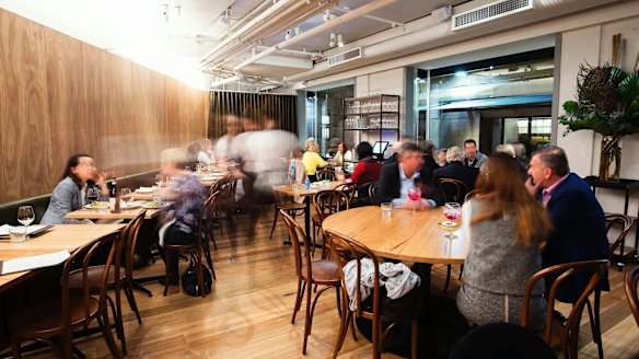 The venue's modest interior with wooden panels.