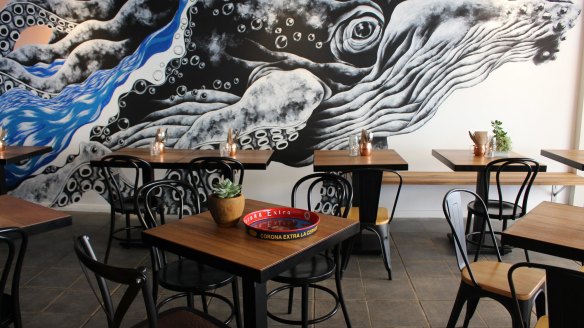 A 'whale-octopus' mural decorates the new venue. 
