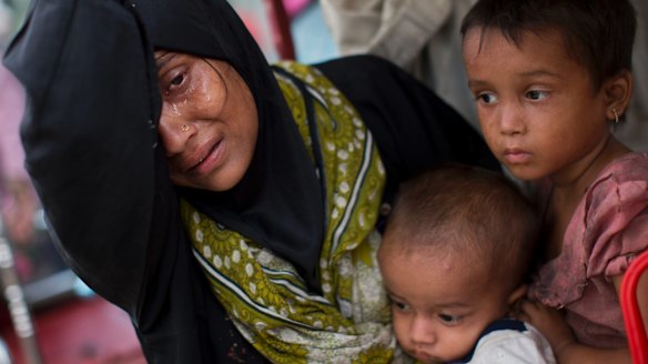 An exhausted Rohingya mother arrives at Kutupalong refugee camp earlier this week.