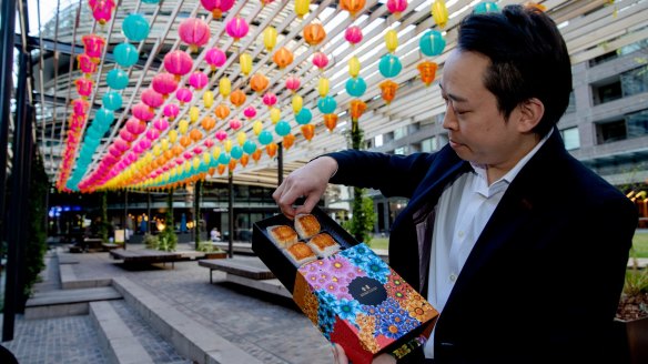 XOPP and Golden Century restaurateur Billy Wong at Darling Square with mooncakes from his restaurants.