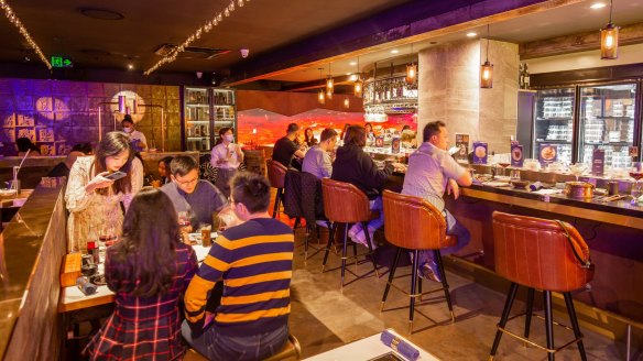 Kew's new Chef David restaurant features a sushi train (right).