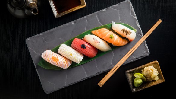 Enjoy some sushi nigiri with a lychee gin and tonic.