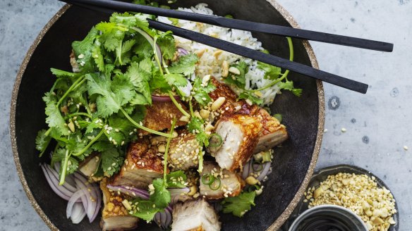 Crispy pork belly with coriander, peanuts and red onion salad.

