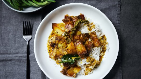 Oven-baked pork belly curry served with snake beans (top left) and steamed rice.