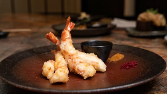 Tempura king prawns are served with a little bowl of dashi soy and two fine-grained salts for dipping.