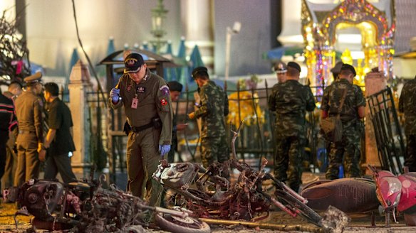 Experts investigate at the site of a blast in central Bangkok.