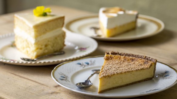 A selection of cakes (on pretty plates) at Holy Sugar. 