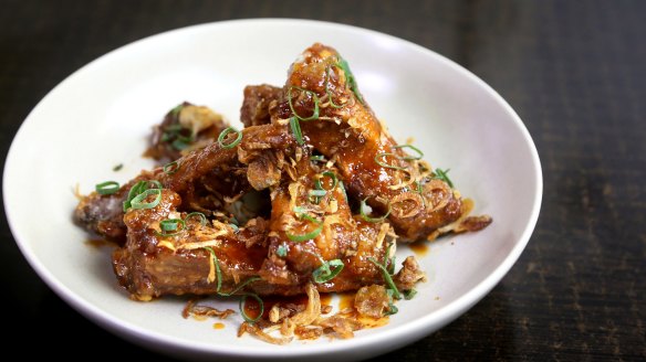 Finger lickin' twice-cooked, sweet and sour pork ribs with palm sugar and tamarind.  