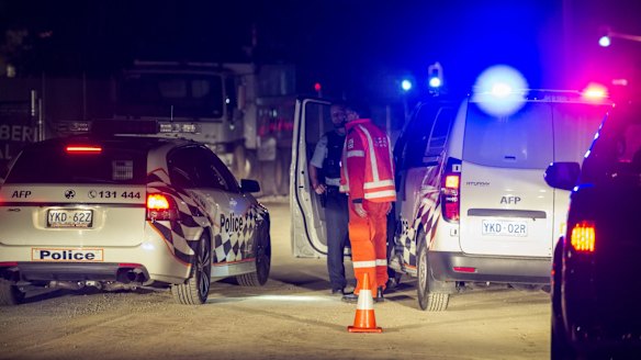 Police and SES staff at the entry to the UC Public hospital building site, where a person died on Thursday night. 