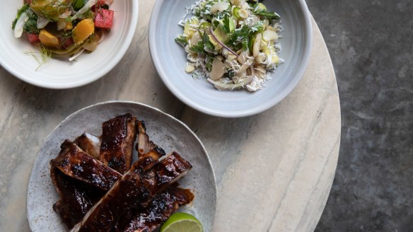 Tomato and watermelon salad, lima bean salad and pork ribs from the new venue.