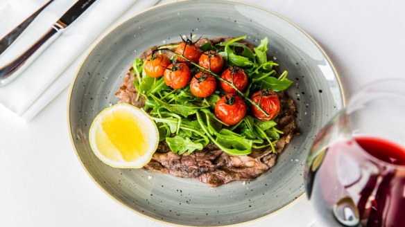 Rangers Valley bistecchina with roasted tomatoes and rocket.