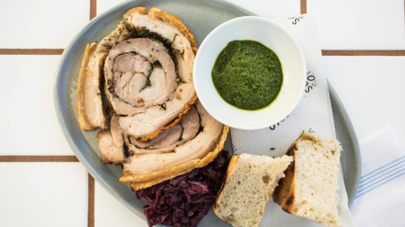 Wood-oven roasted porchetta with red cabbage and salsa verde.