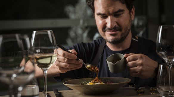 Pt Leo Estate culinary director Josep Espuga dresses a dish of burrata, radicchio and broad beans with his chorizo XO sauce.