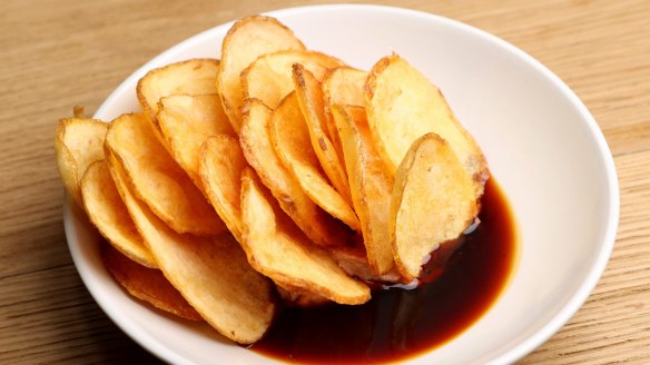 Chicken liver pâté studded with potato chips, in a pool of fish sauce caramel.