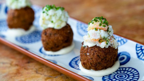 Spanner crab-topped chickpea fritters. 