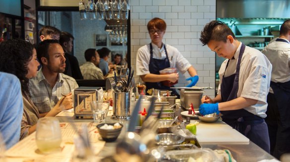 Preparing food in the open kitchen at 22 Ships. 