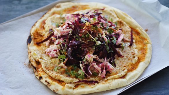 Chermoula chicken, beetroot and hummus pizza.