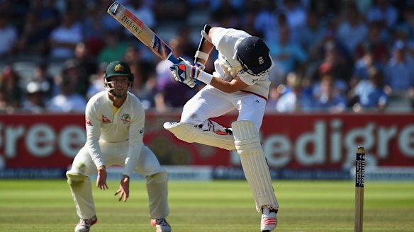 Stuart Broad takes evasive action to avoid an Australian bouncer at Lord's on Sunday.