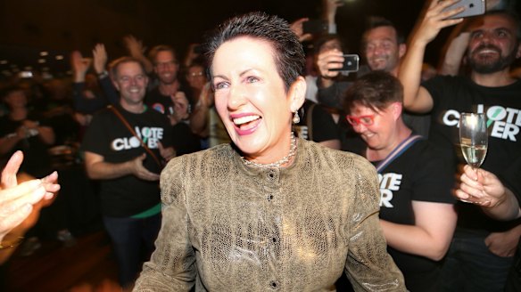Supporters of Sydney lord mayor Clover Moore cheer her entrance on Saturday.