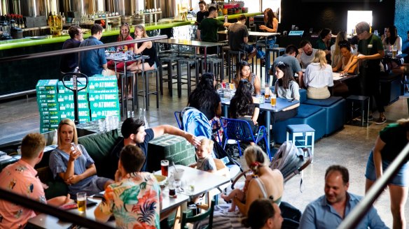 Atomic Beer's interior: a two-tiered mix of polished concrete, subway tiles and bold primary colours.