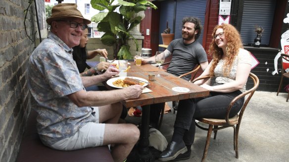 "A great beer garden is es]sential for any proper Aussie pub". Punters enjoy an outdoor schnitzel at the OxfordTav.