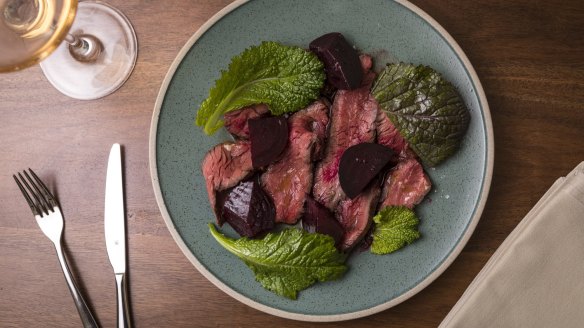 Hanger steak with mustard leaf and beetroot.