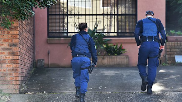 NSW Police officers at the family home of Justine Damond on Sydney's northern beaches on Monday.