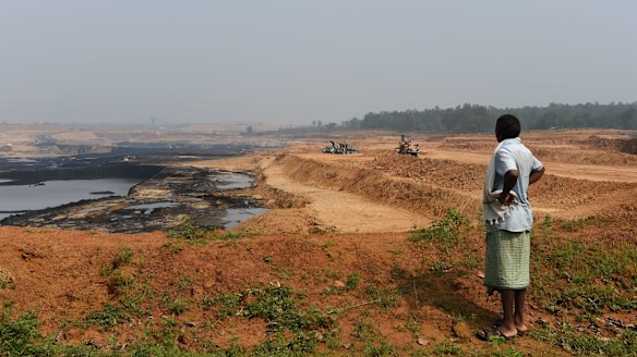 A Gonds tribesman looks over central India’s Parsa East and Kante Basan coal mine. Operated by Adani, the mine has had a severe impact on the local environment.