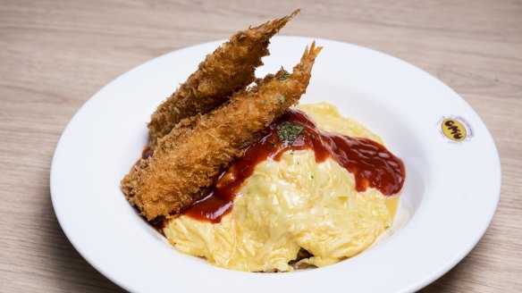 Omurice with tempura, tomato sauce and melted cheese.