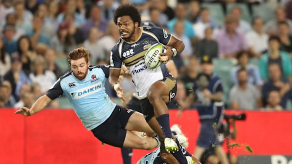 Speed bump: The Waratahs stumble over themselves trying to stop Henry Speight.