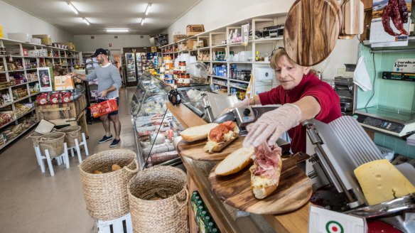 Meat and cheese are sliced to order for the sandwiches.