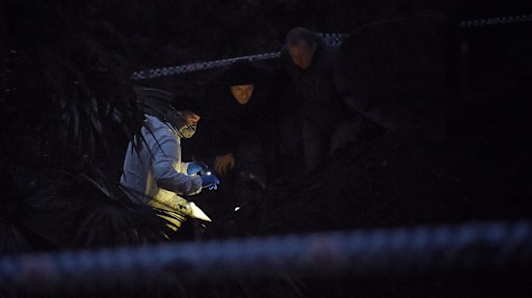 By nightfall, forensic officers in white suits were huddled over the bones with torchlights.