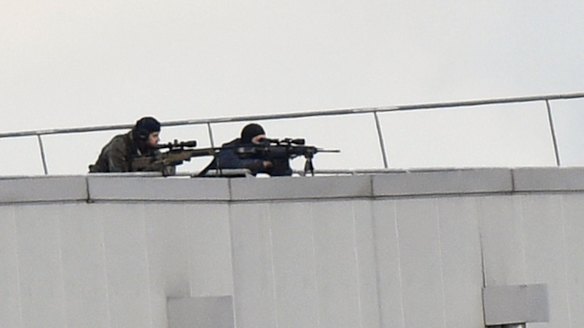 Police marksmen take up position on a roof in Dammartin-en-Goele.