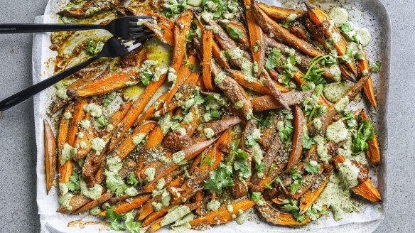 Sweet potato fries loaded with green tahini, harissa and zaatar salt.