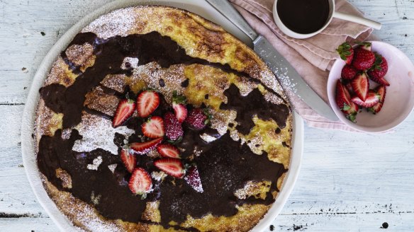 Giant baked crepe drizzled with chocolate sauce.
