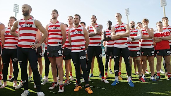 Sydney players stand in solidarity for teammate Adam Goodes.