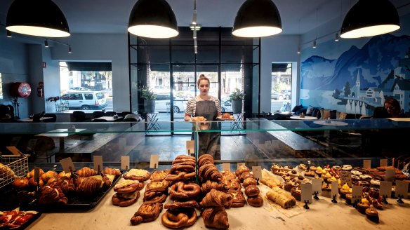 The bakery features a mural of the Austrian village of Hallstatt (right).