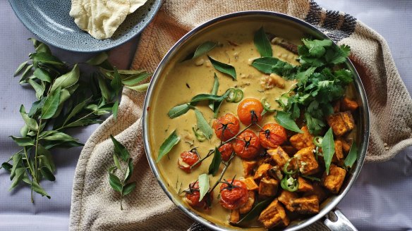 Vibrant vegan sweet potato, tomato and tamarind curry.