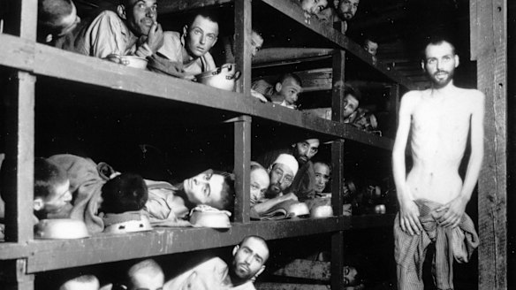 This April 16, 1945 file photo provided by the US Army shows inmates of the  Buchenwald concentration camp. The young man seventh from left in the middle row bunk is Elie Wiesel.