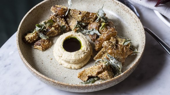 Jerusalem artichoke wedges with hummus and parsley oil.