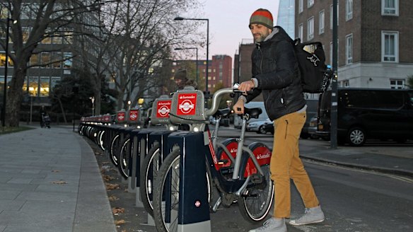 A man takes a Santander bike in London on Monday.