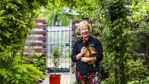 Vicki Still with one of her chickens.