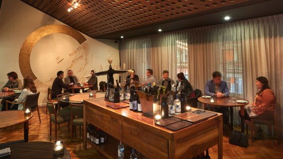 The intimate space features an enormous wine island covered in artful decanters and new and natural wines.