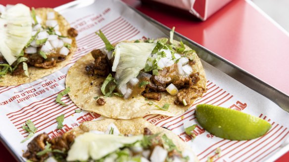 Tacos al pastor with pork and pineapple.