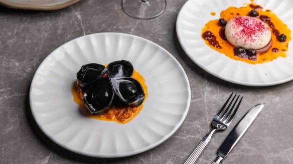 Squid ink tortellini with crab meat, roast tomato and lemon and caper sauce.